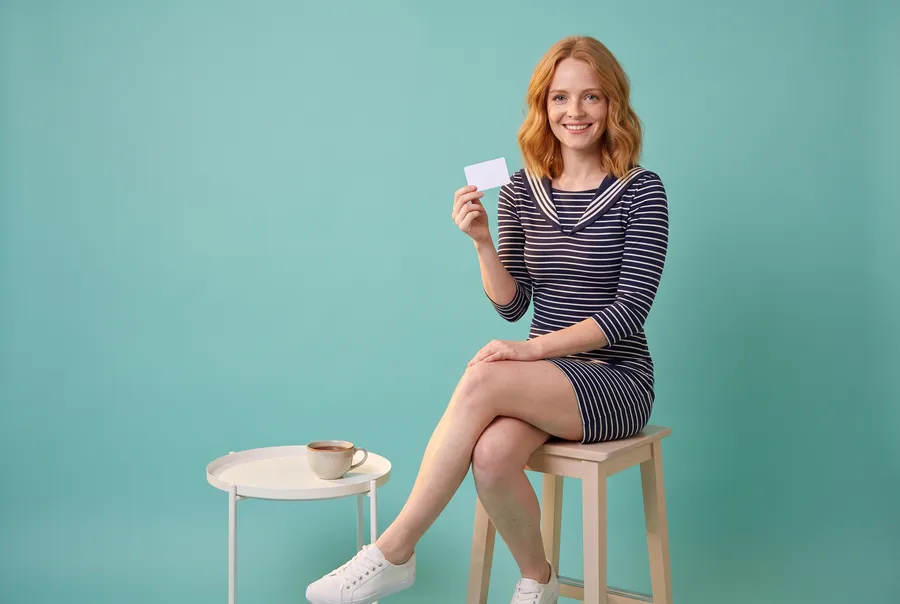 Woman holding a blank players card